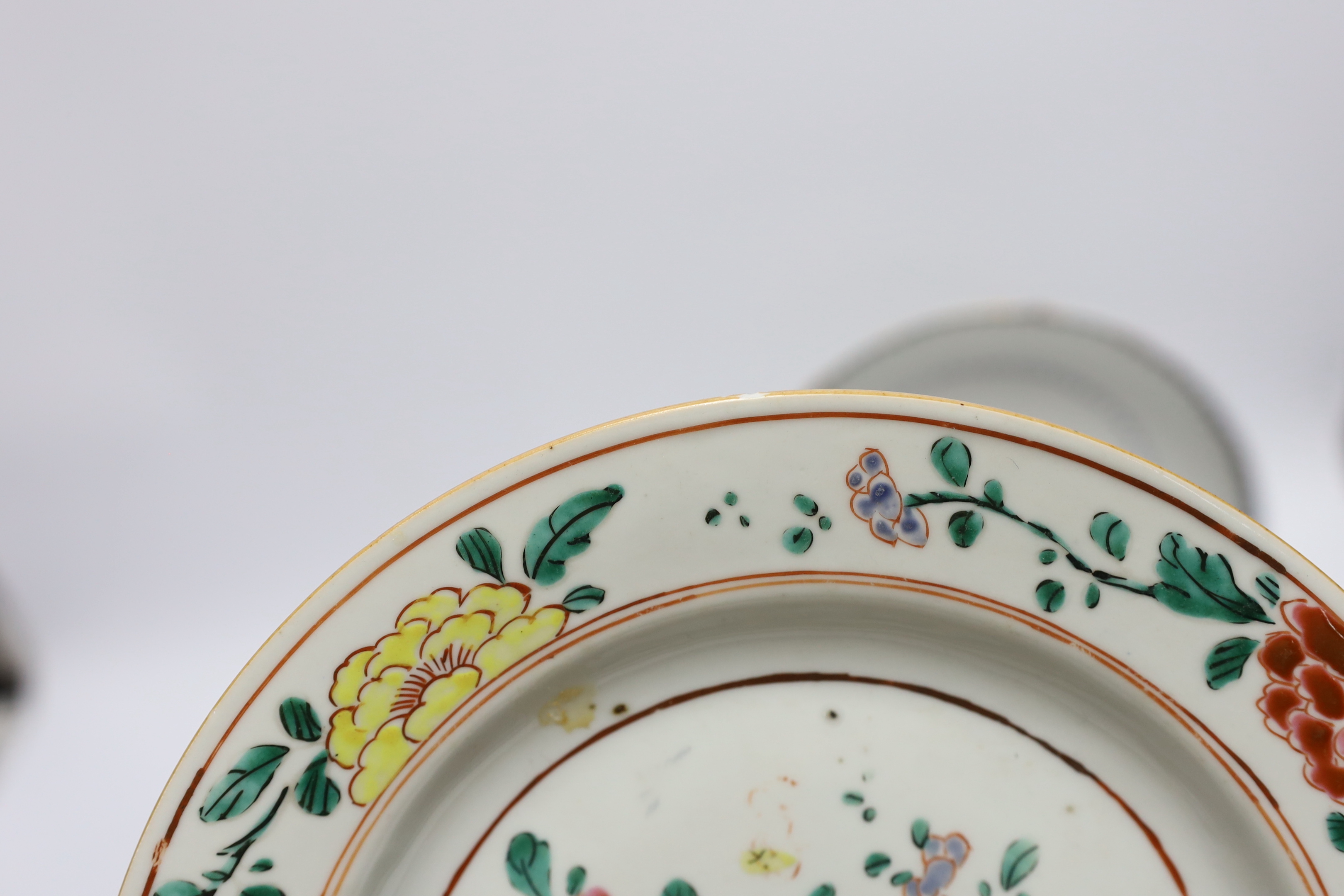 A Chinese famille rose plate together with two armorial or crested dishes, 23cm diameter